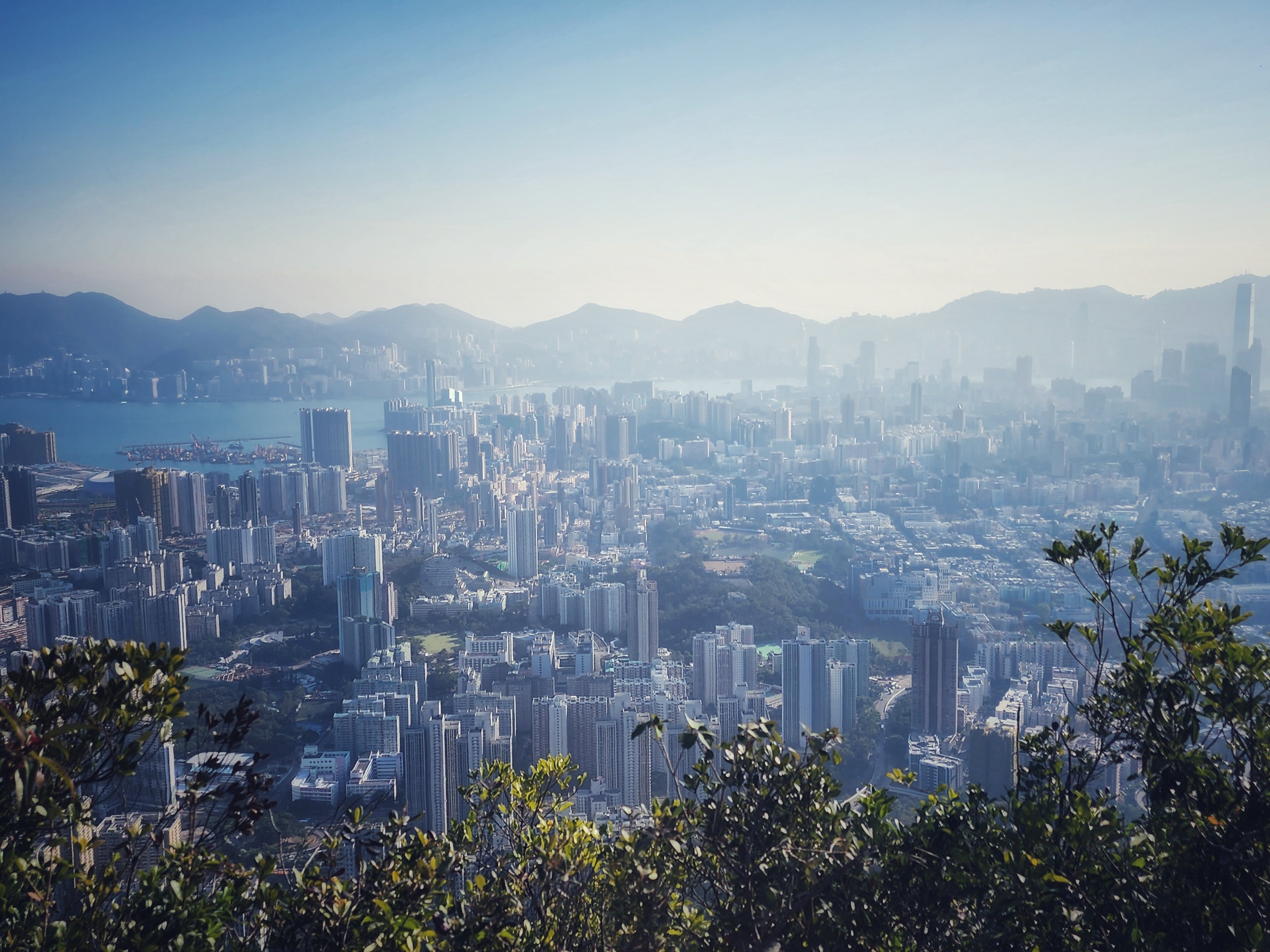 Cityscape with buildings and mountains in the background